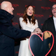 Chairman and CEO of MacAndrews & Forbes Holdings Inc. Ron Perelman, actress Olivia Wilde and CEO of Revlon Lorenzo Delpani attend Revlon’s “Love Is On” event Nov. 18, 2014, in Times Square in New York City.
Cindy Ord/Getty Images for Revlon